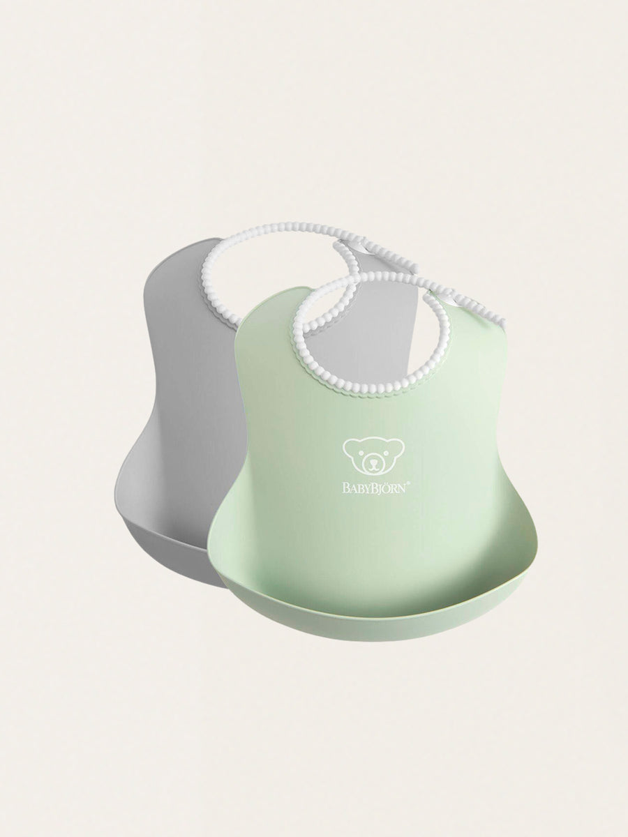 Set of two bibs with adjustable fastening
