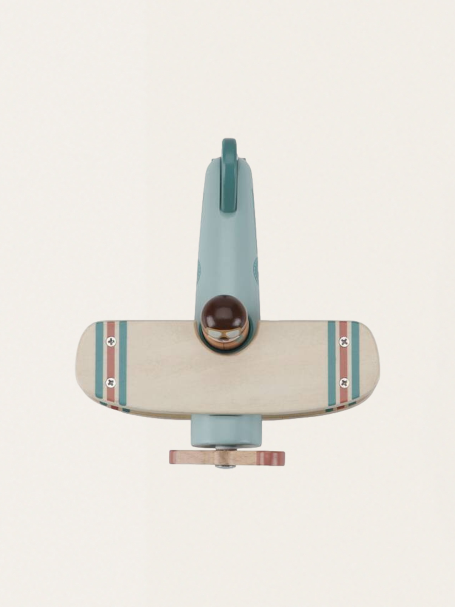Wooden airplane with a pilot figure