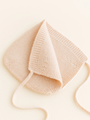 Newborn bonnet made of Italian merino wool Oat