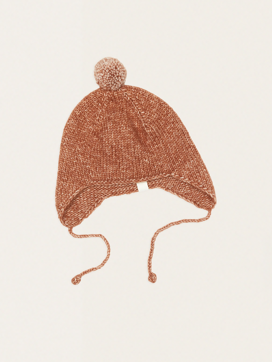 Hand-woven earflap hat with a pompom